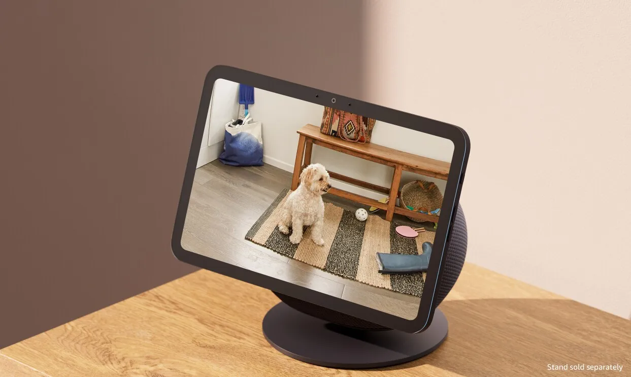 a photo of a new Amazon Echo Show featuring a display with a photo of a dog on a rug.