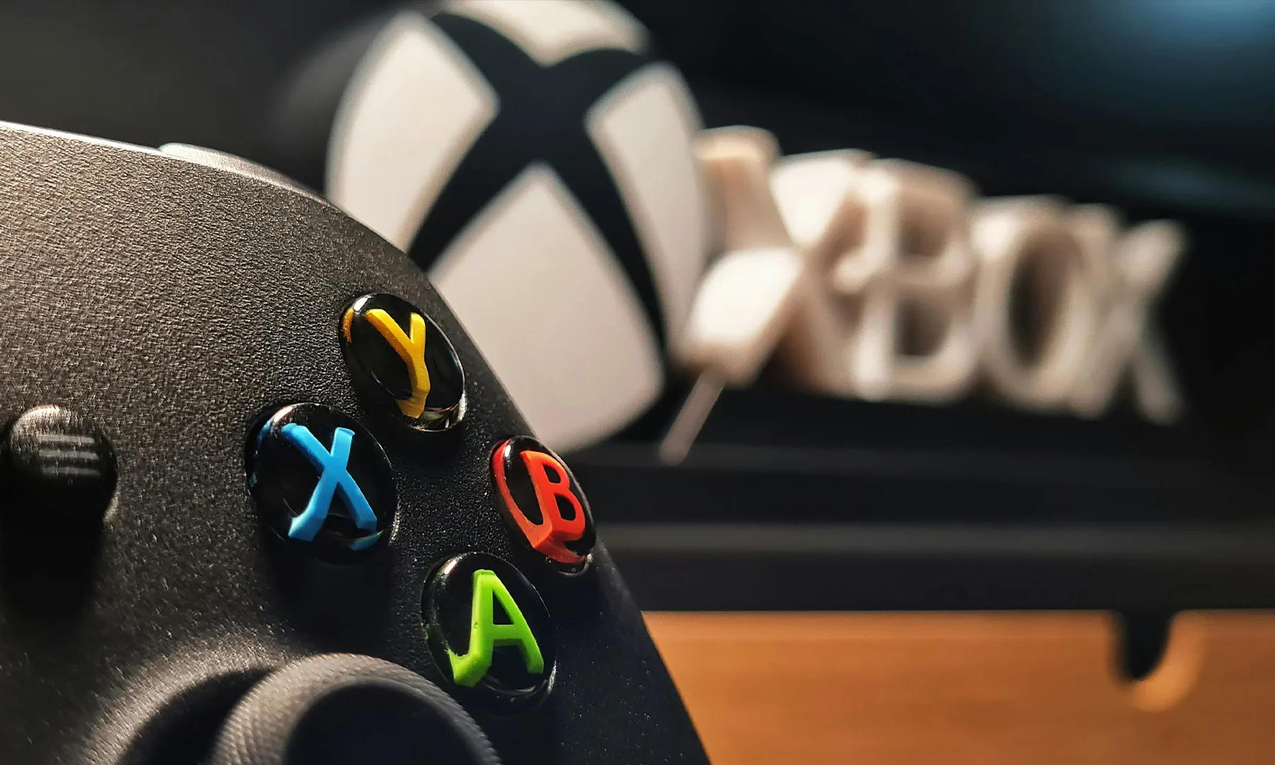 Xbox Controller with Xbox Logo in Background
