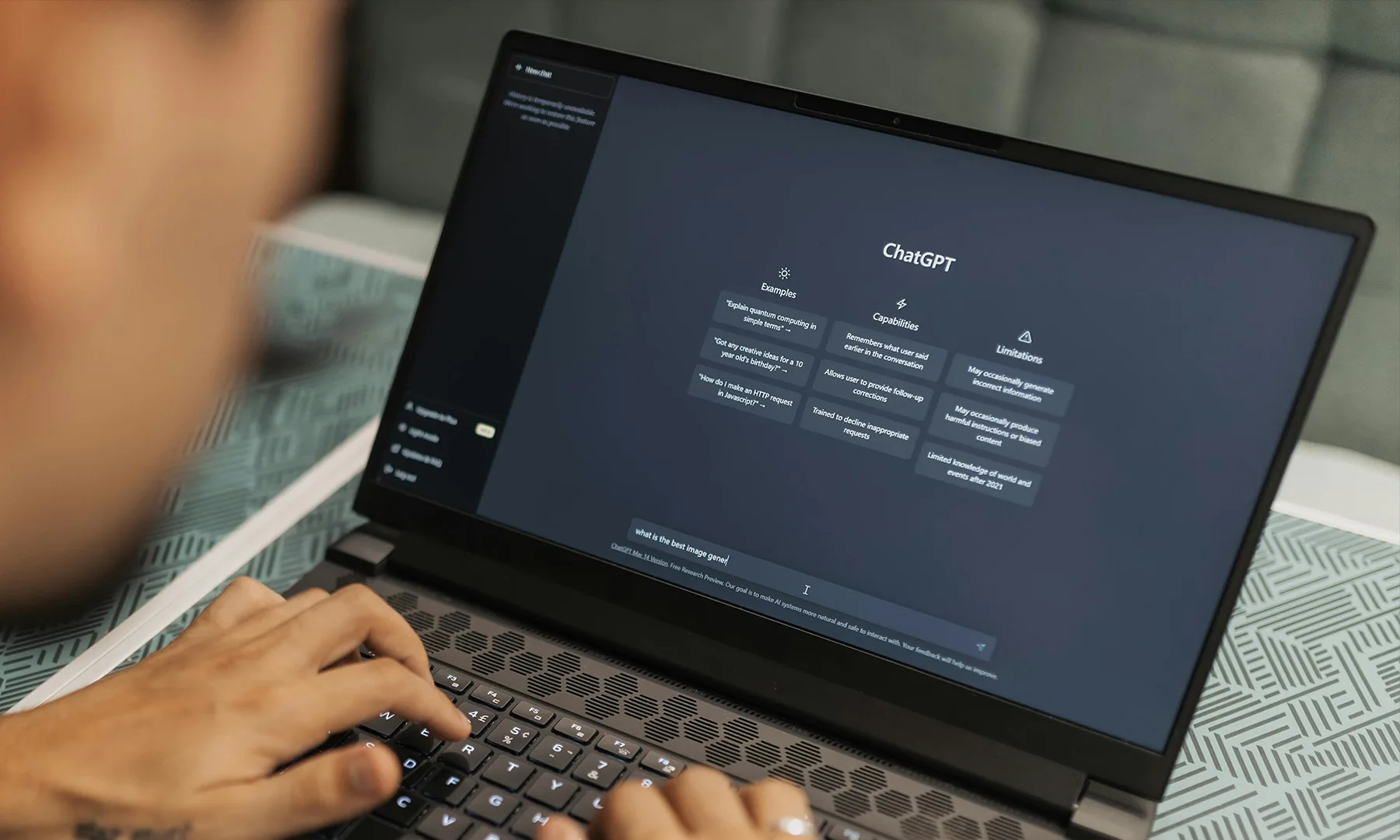 Man using ChatGPT on a laptop